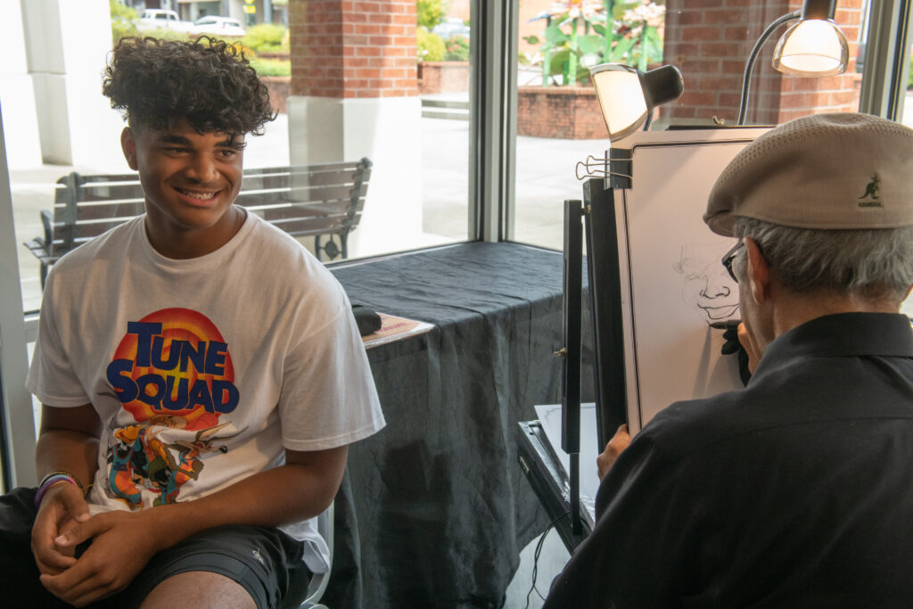 Attendee enjoys having his caricature drawn at Cerrowire’s 100-Year Anniversary Celebration.