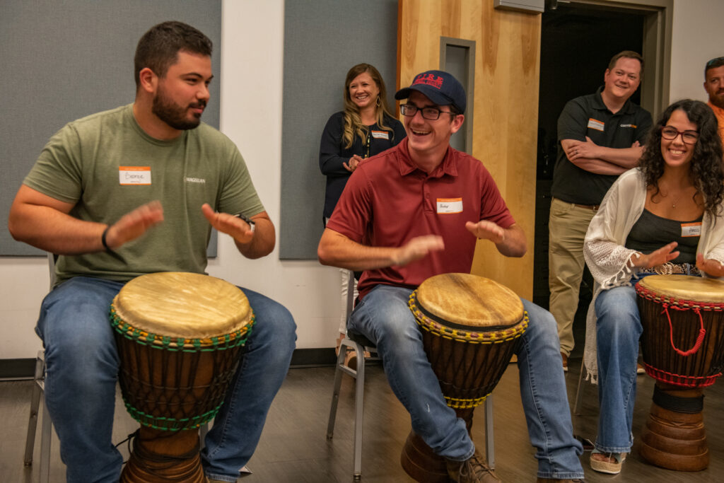 Celebrants keep the beat in drumming class during Cerrowire’s 100-Year Anniversary Celebration in Georgia.