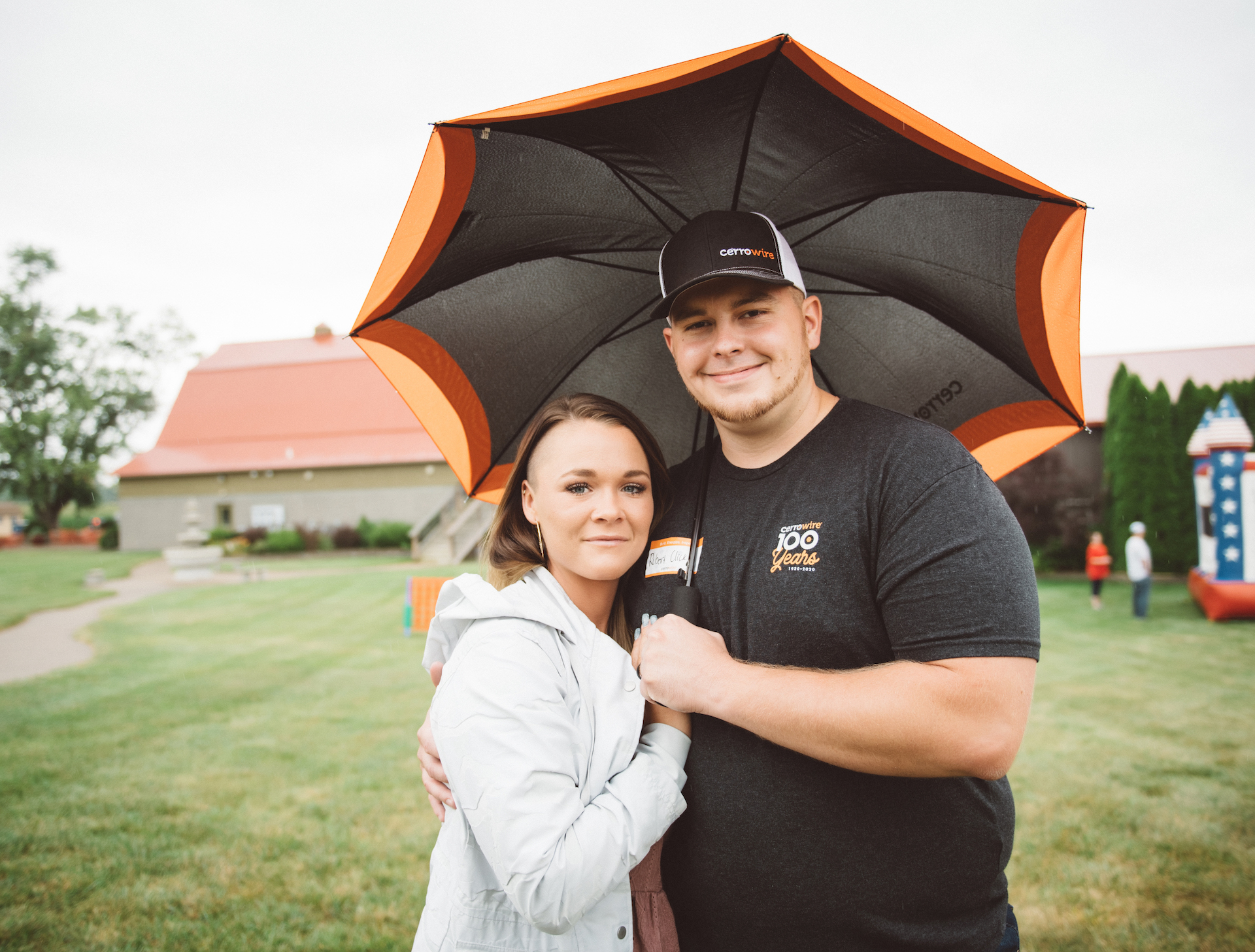 Couple stays dry during 100-Year Anniversary Celebration at Chateau de Pique in Indiana.